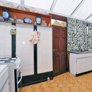 Old fashioned picture of a kitchen area before renovation