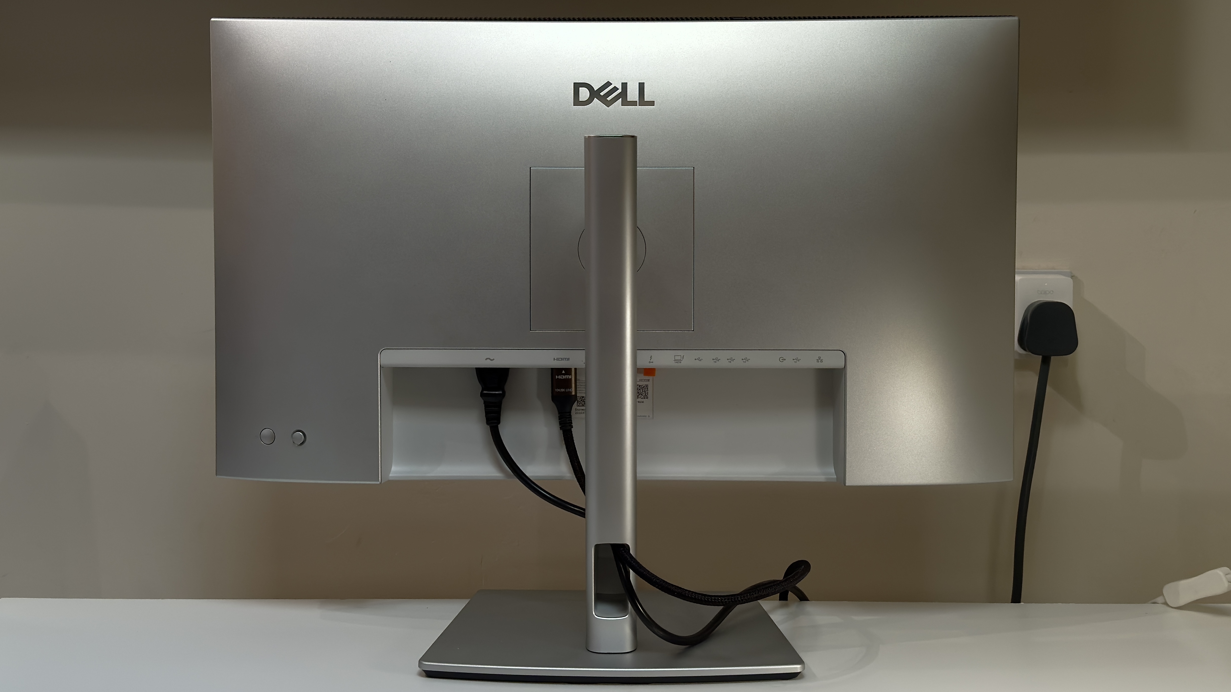 The DellUltraSharpe U2725QE monitor on a desk