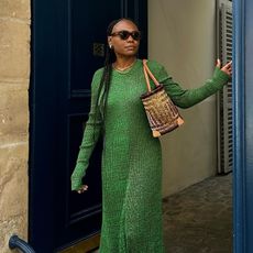 Franny wears a green knit dress