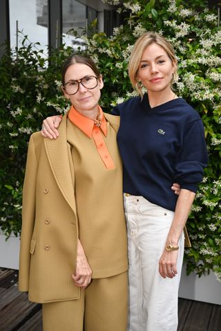 Louise Trotter and Sienna Miller attend the French Open in 2022