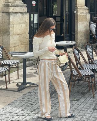 @annelauremais wearing pajama-inspired trousers.