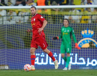 Grzegorz Krychowiak in action for Abha against Al-Nassr in October 2023.