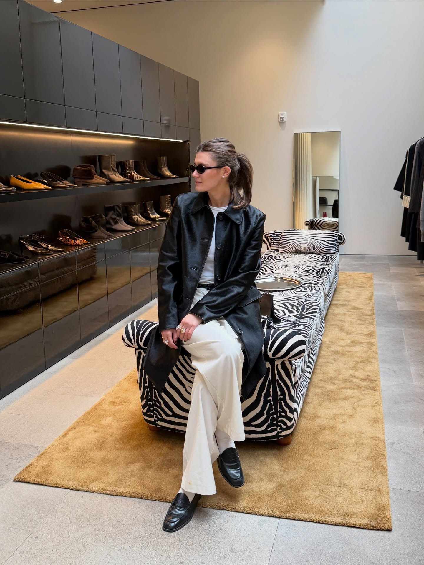 Woman wearing fall outfit with loafers.