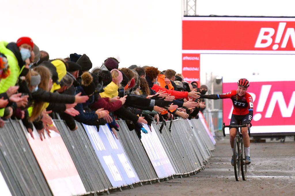 KOKSIJDE BELGIUM NOVEMBER 21 Annemarie Worst of The Netherlands and Team 777 celebrates winning and waves to the crowd during the 50th Koksijde UCI CycloCross Worldcup 2021 Womens Elite CXWorldCup on November 21 2021 in Koksijde Belgium Photo by Luc ClaessenGetty Images