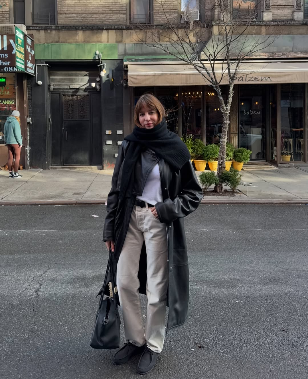 Lizzie wearing beige jeans