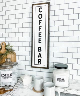 2TreesStudios vertical coffee bar sign in kitchen with white wall tile decor