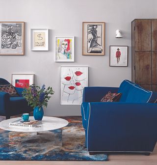 living room ideas blue sofa and gallery wall