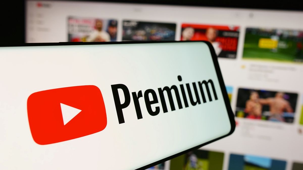 YouTube Premium logo on a phone in front of YouTube on a browser