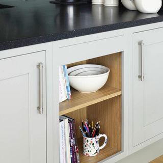 kitchen with wooden shelves and white bowl