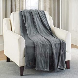Brookstone Ultra Soft Electric Blanket on an armchair.