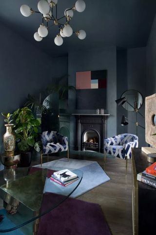 Dark blue living room with painted walls and ceilings