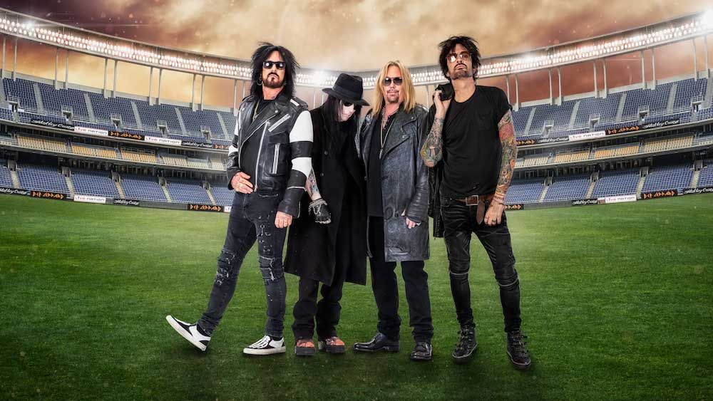 Motley Crue standing in a stadium 