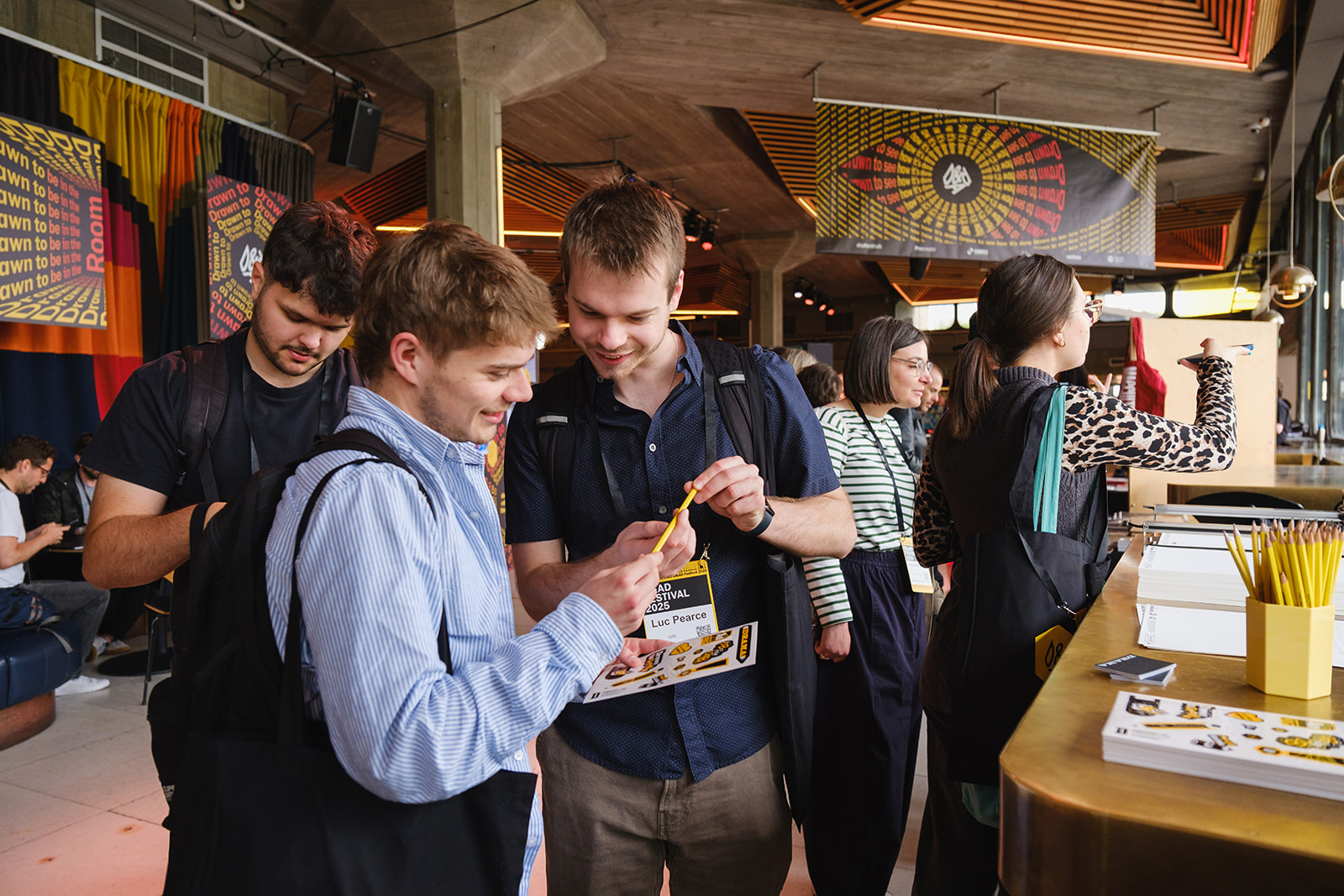 D&AD Festival images of men at the festival in the foyer