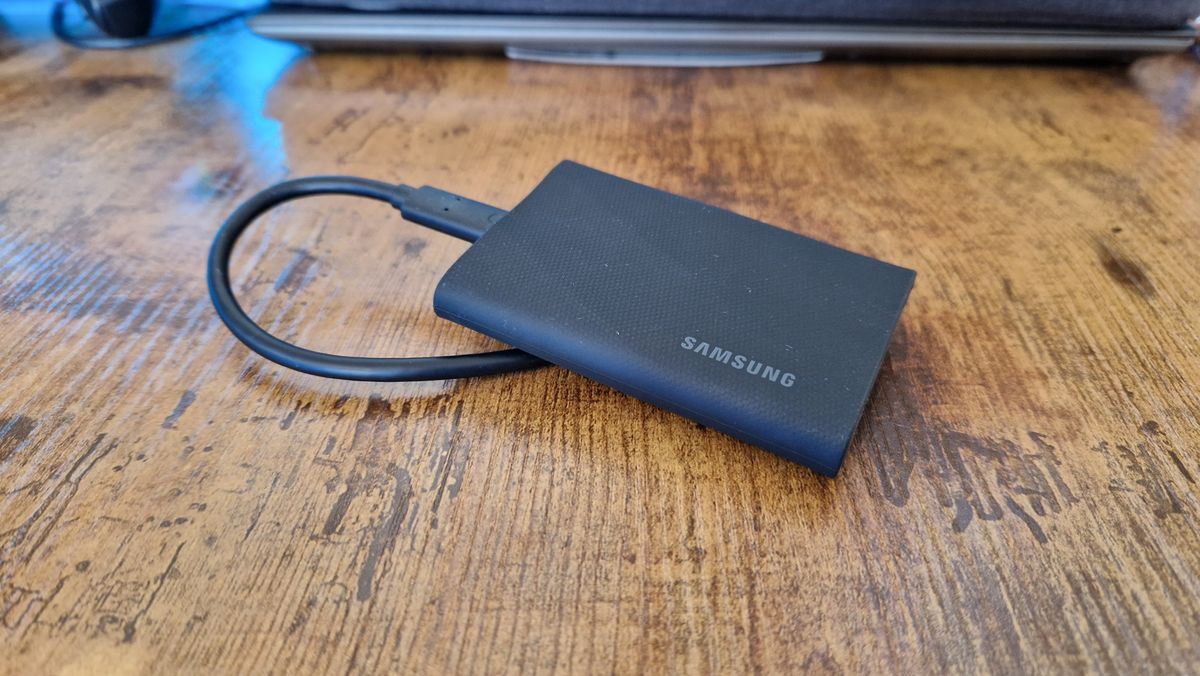 Samsung T9 SSD lying on its cable