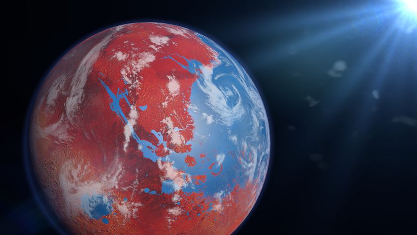 Image of a planet in space. The planet has red land masses surrounded by large areas of blue water dotted with white clouds. 