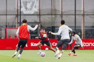 Milos Kerkez and Jeremie Frimpong of Liverpool during a training session at AXA Training Centre on July 15, 2025 in Kirkby, England