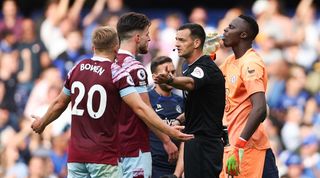 West Ham midfielder Declan Rice speaks to the referee after Maxwel Cornet's late strike is ruled out by VAR in the 2-1 defeat against Chelsea.