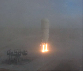 This view of Blue Origin's second test vehicle shows the suborbital rocket just before landing during a 2011