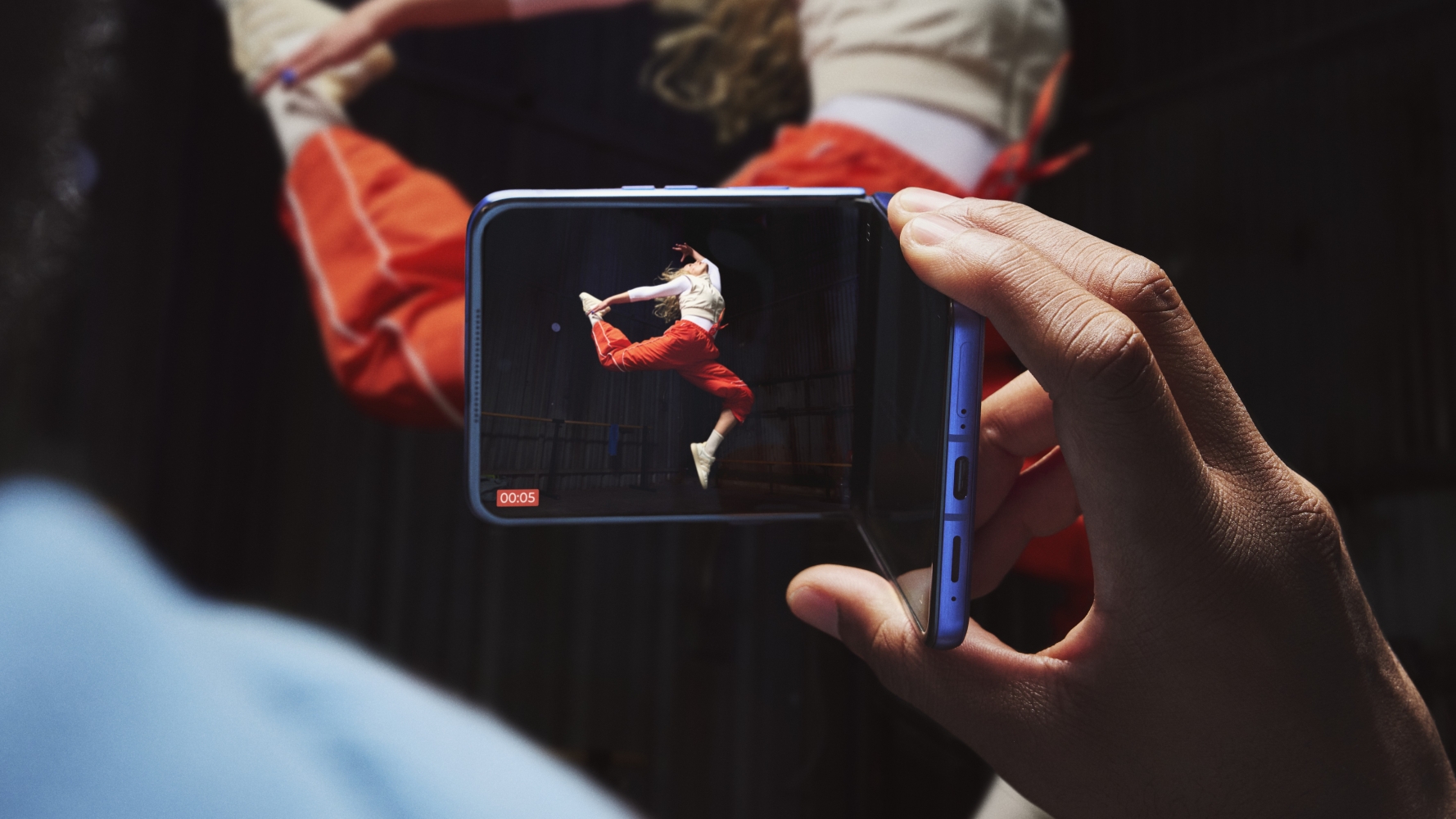 Someone holding the Motorola Razr Ultra 2026 in camcorder mode and recording a dancer