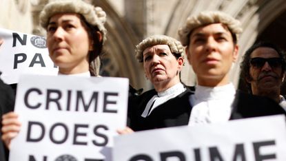 Barristers on strike outside the Royal Courts of Justice in London 