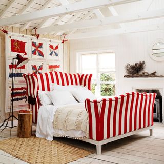 bedroom with red stripes and white wall