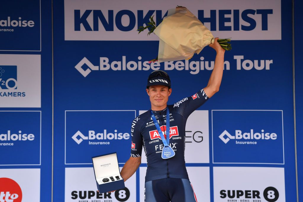 KNOKKEHEIST BELGIUM JUNE 16 Jasper Philipsen of Belgium and Team AlpecinFenix celebrates at podium as stage winner during the 91st Baloise Belgium Tour 2022 Stage 2 a 1756km stage from Beveren to KnokkeHeist BaloiseBelgiumTour on June 16 2022 in KnokkeHeist Belgium Photo by Luc ClaessenGetty Images