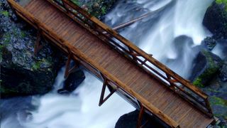 A wooden bridge over a creek