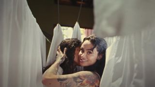 Kehlani and their partner in the music video for "Melt," off the singer's 2022 album Blue Water Road
