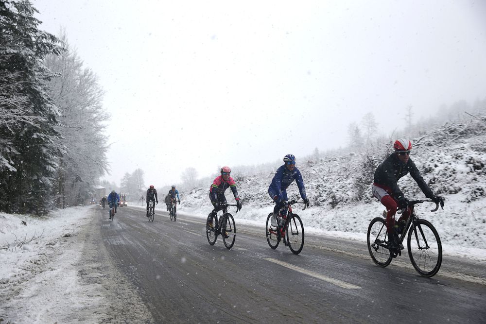 Pack rides under the snow during the third stage of the 74th edition of the Paris-Nice