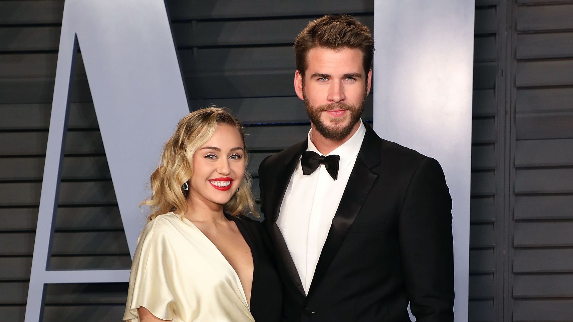 Miley Cyrus and Liam Hemsworth attend the 2018 Vanity Fair Oscar Party