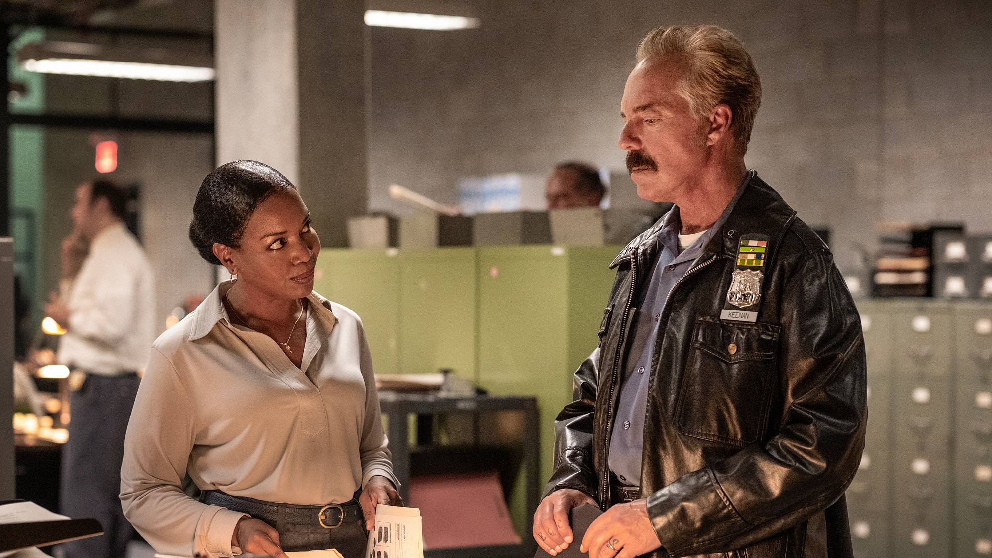 Jessica Frances Dukes as Agent Birdie Polk and Titus Welliver as Officer Glenn Keenan in "The Westies" on MGM+