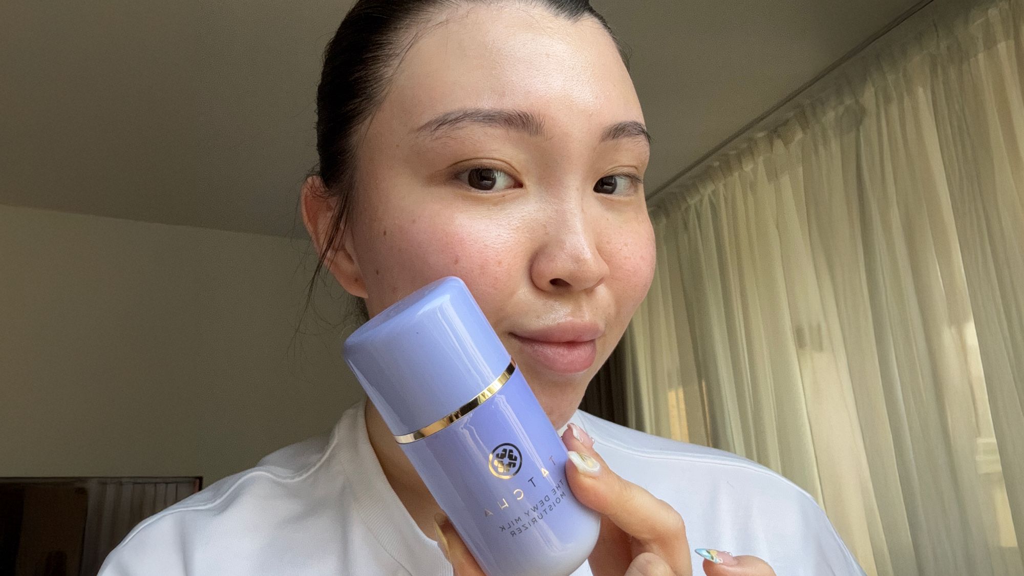Denise Primbet testing the Tatcha Dewy Milk Moisturiser