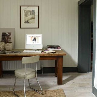 desk area with wooden desk and chair and wooden floor
