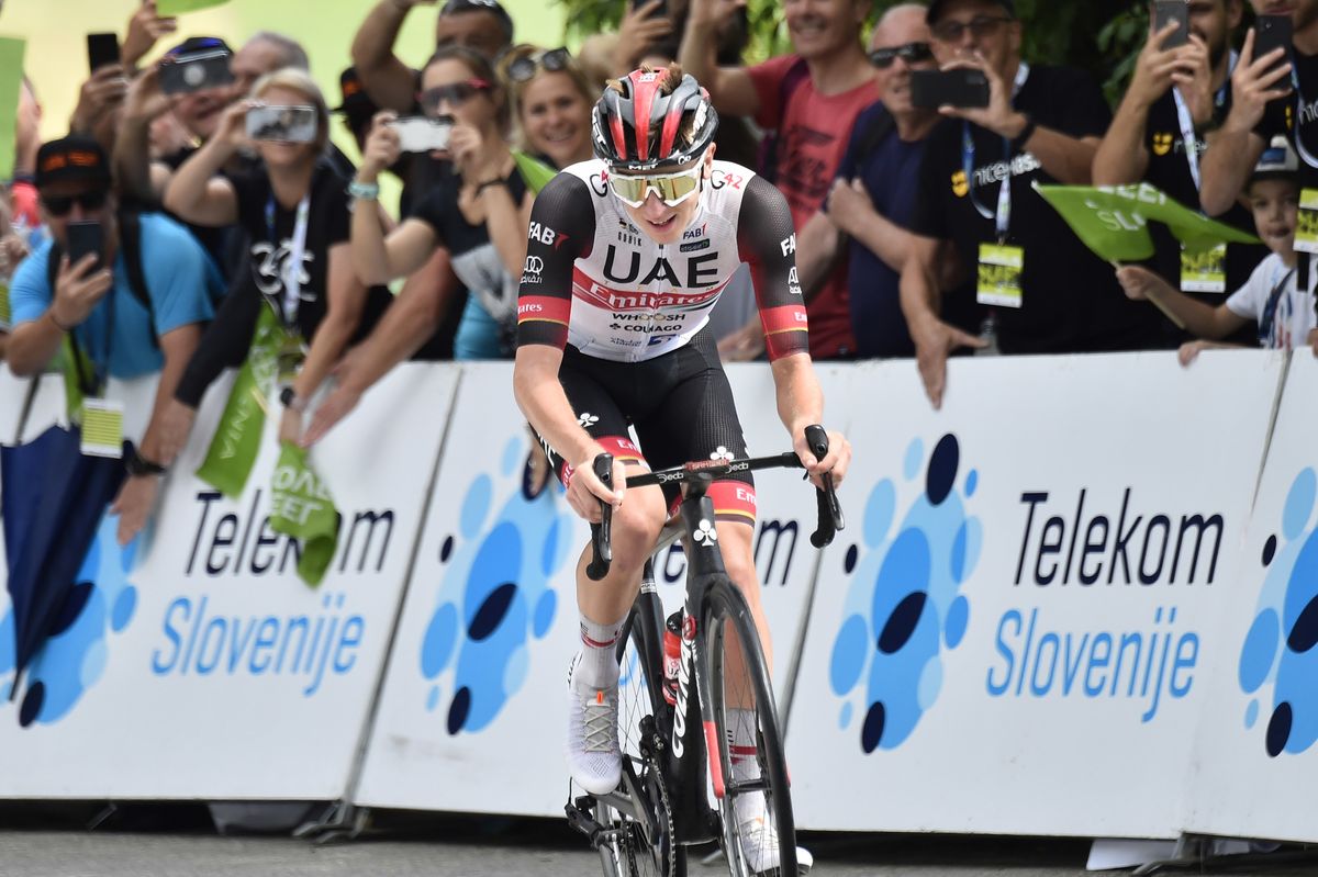 Tadej Pogacar heads to the finish alone