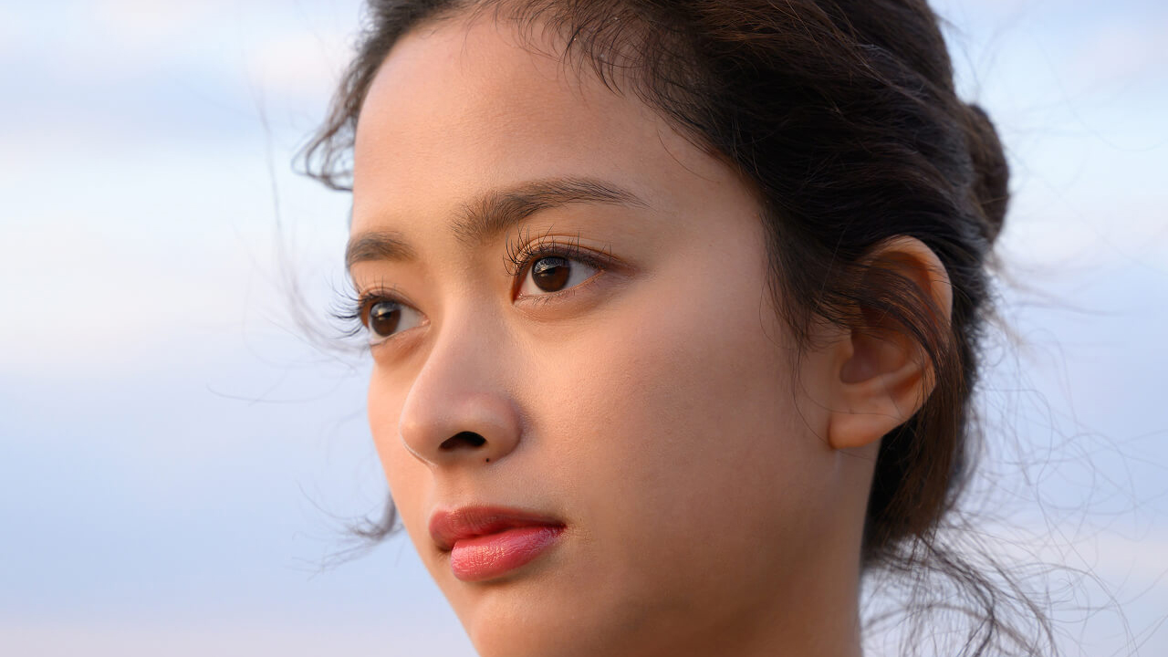 A sample photo of a woman's face taken with the Nikon Nikkor Z 24-105mm f/4-7.1 lens