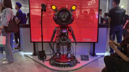 Asus ROG Robot PC with people beside it on Computex 2025 showfloor