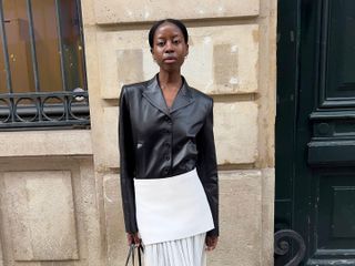 Fashion influencer @sylviemus_ in Europe wearing a chic outfit for 2025 styled with a blazer.