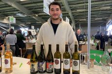 Roman Tournier showing his wines made from Piwi grapes at Millésime Bio wine fair 2025.