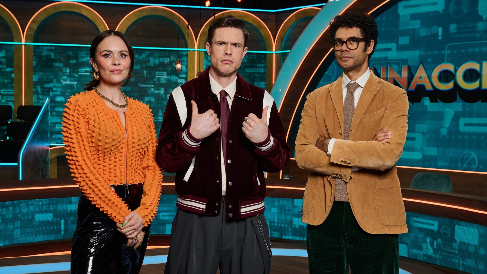 an image from the show Unacceptable showing team captain Joanne McNally, next to Ed Gamble and fellow team captain Richard Ayoade