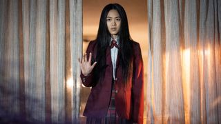 Aya Furukawa, standing against a window, as School Girl in episode 101 of The Midnight Club