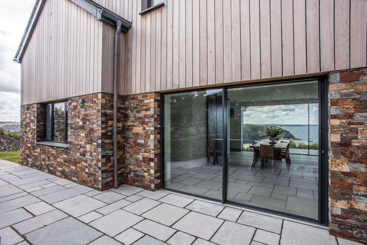 The bottom floor has stone exterior walls