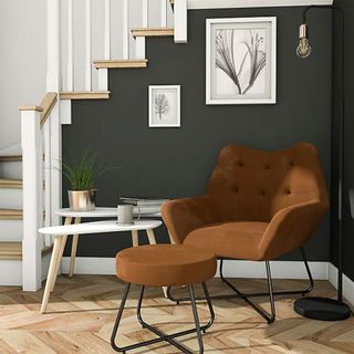 Turio Burnt orange Velvet effect Chair in a hallway with a dark feature wall and light parquet flooring
