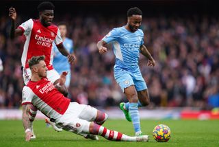 Arsenal’s Ben White (left) and Manchester City’s Raheem Sterling battle for the ball during the Premier League match at the Emirates Stadium, London. Picture date: Saturday January 1, 2022