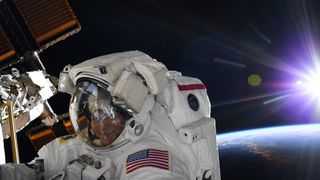 NASA astronaut Anne McClain is pictured during her first spacewalk on March 22.