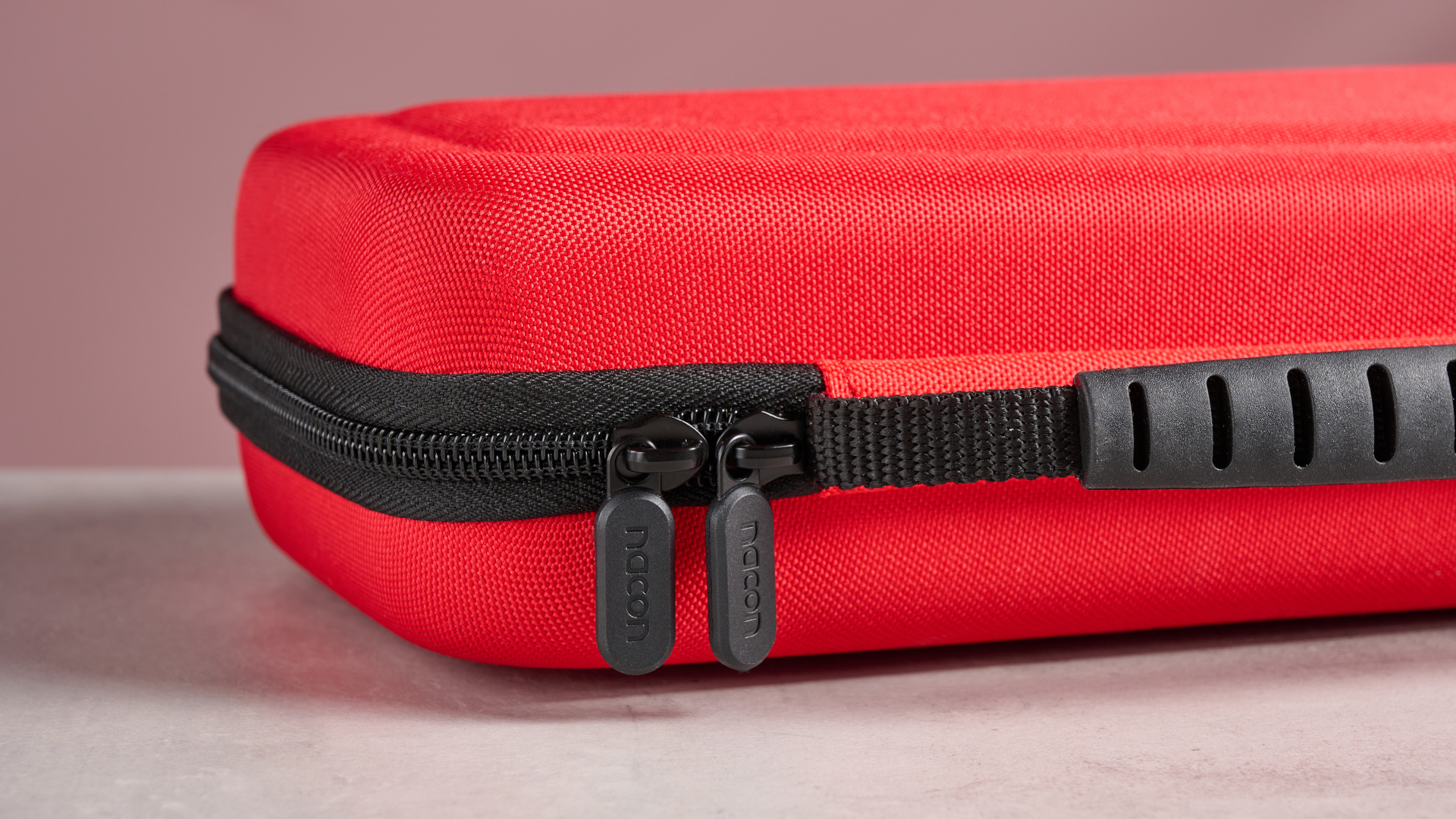 A close up of the zip and the handle of the Nacon Hard Carrying Case for Nintendo Switch 2.
