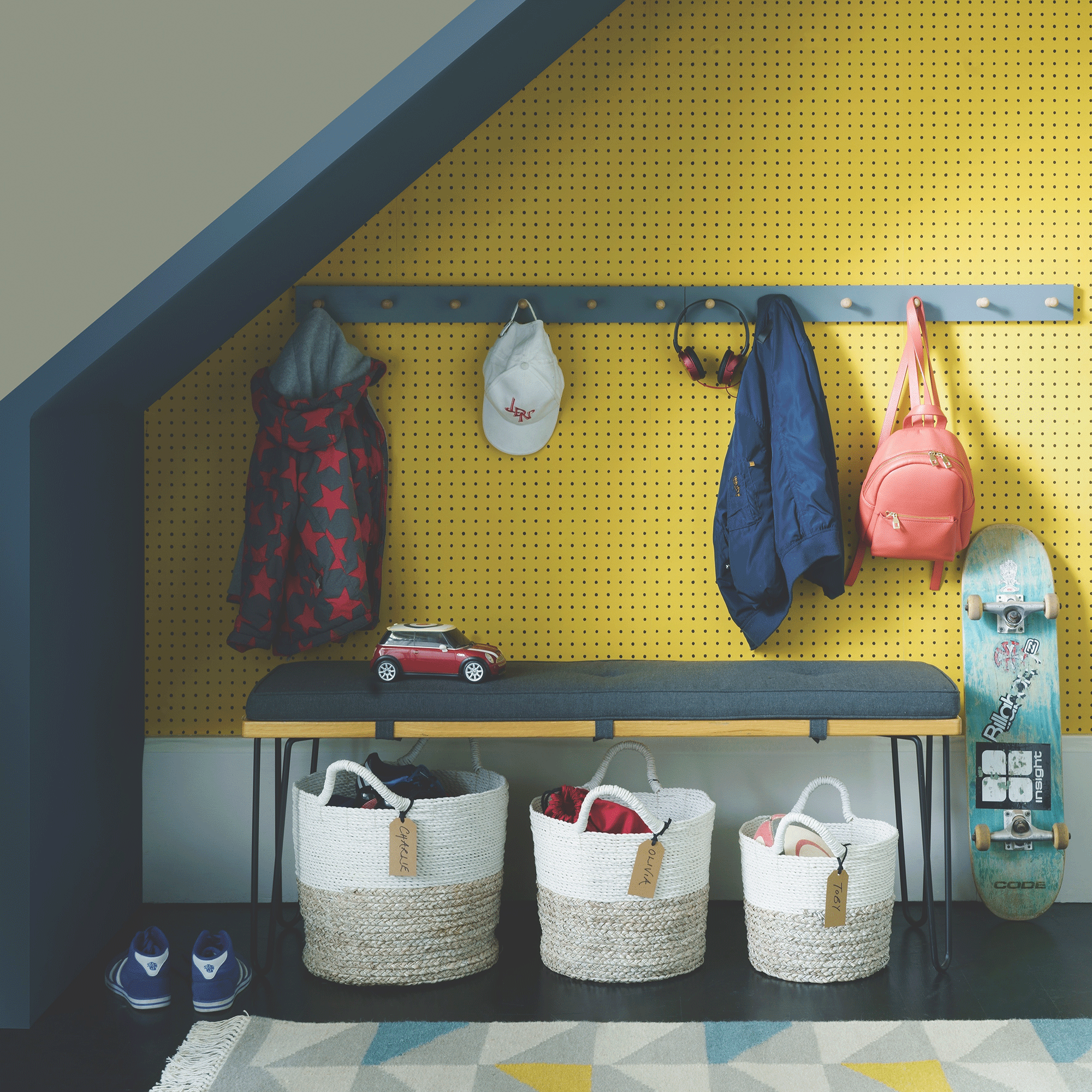 Yellow hallway with blue coat rack