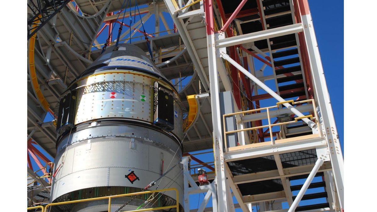 Boeing engineers prepare a CST-100 Starliner crew capsule for a critical pad abort test on Nov. 4, 2019 at the White Sands Missile Range in New Mexico.