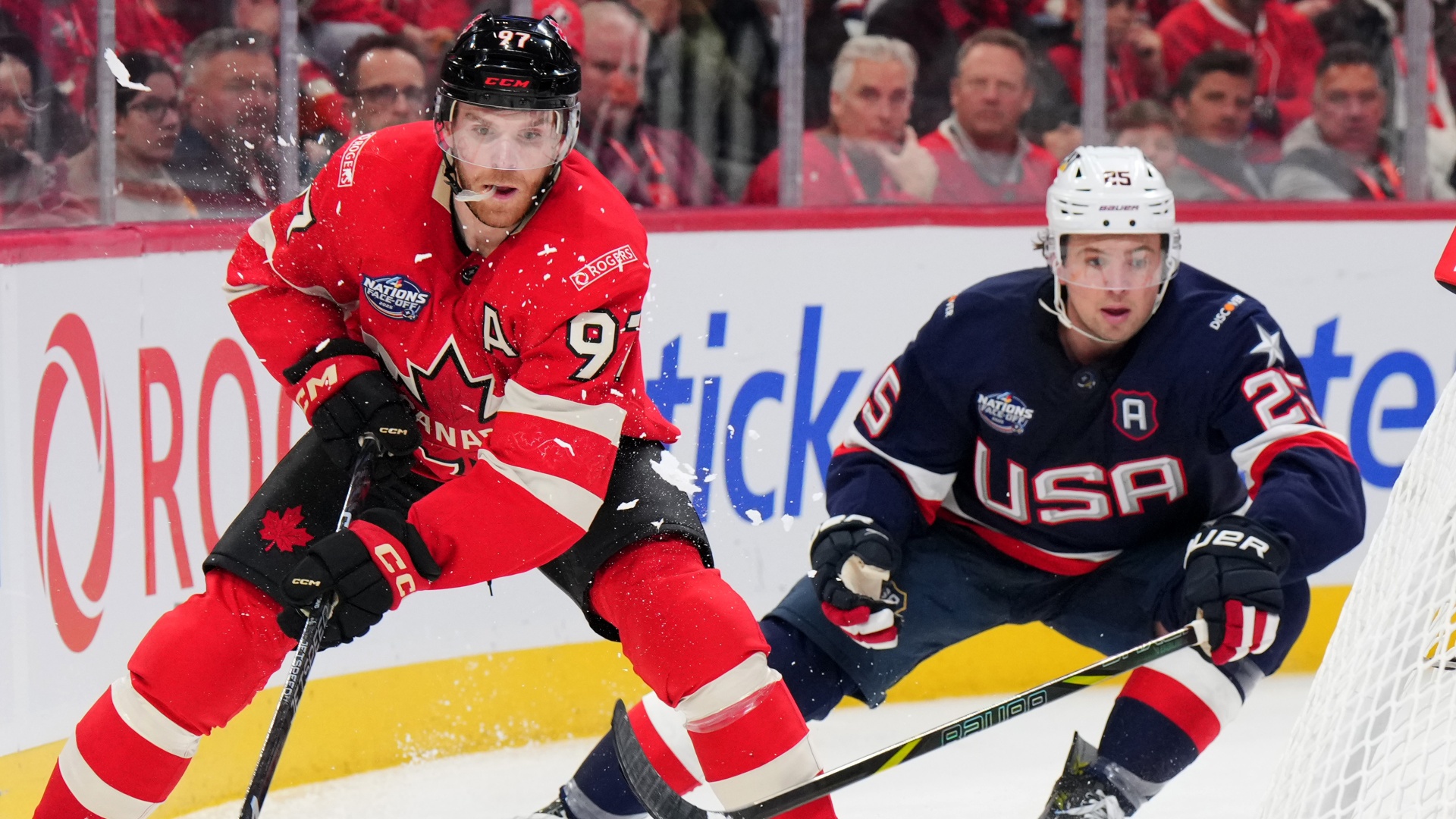 Canada's Connor McDavid and USA's Charlie McAvoy in ice hockey action