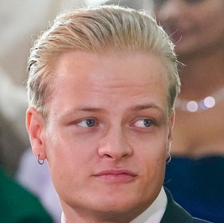 Marius Borg Hoiby wearing a tux and hoop earrings looking to his right