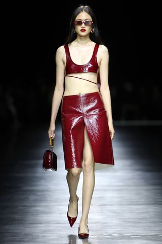 Gucci Ancora red trend runway model crop top skirt leather pumps handbag Milan Fashion Week